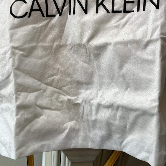 Interior picture of yellow Calvin Klein bag. Noticed flaw on interior - Picture 8 of 9